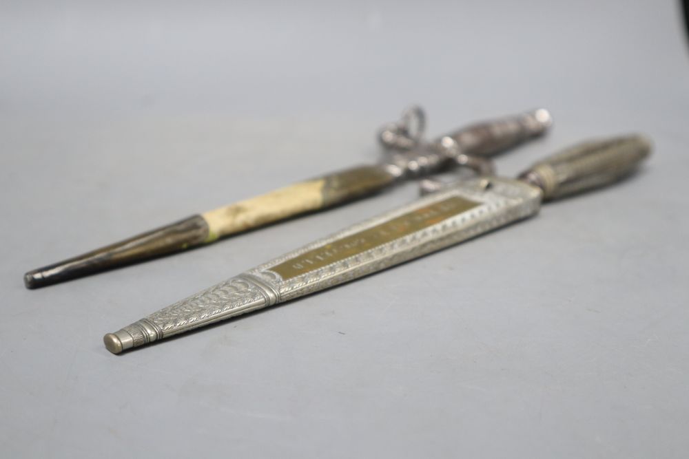 An Italian 19th century dagger stiletto, engraved silver mounts, horn grip, brass sheath sides with inscription Di Coltello Perira Chi